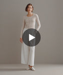 Thumbnail for video: Model showing Cashmere Finley Cardigan paired with trousers.