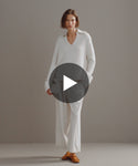 Thumbnail for video: Model walking in-studio wearing Cashmere Phoebe Polo.