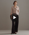 Thumbnail for video: Model walking in-studio wearing Demi Pants in Black.
