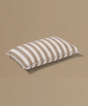 Striped pillow on a beige background