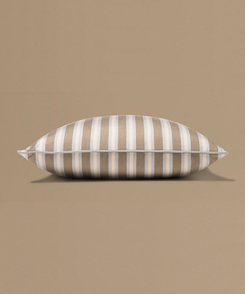 Striped pillow on a beige background