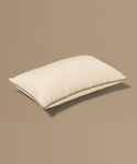 Beige pillow on a beige background