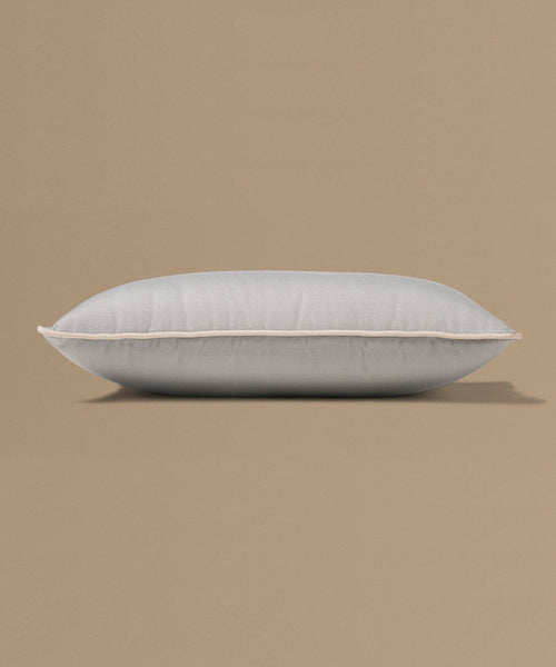 Gray pillow on a beige background