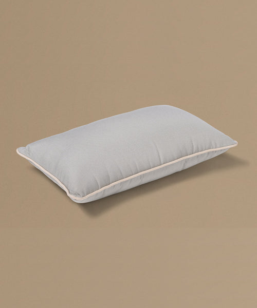 Gray pillow on a beige background