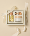The Relaxation Bath Set includes Oak Essentials oil, cream, and a small applicator, all arranged on a light beige background with a satin ribbon.