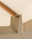 Close-up of a wooden frame corner with beige fabric corners.