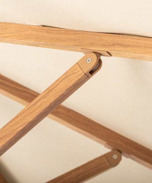 Close-up of a wooden umbrella with a beige background