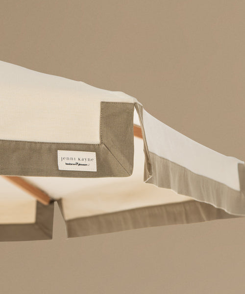 Close-up of a product with a brand label on a beige background