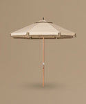 Beige patio umbrella with wooden handle on a beige background