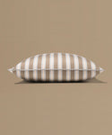 Striped pillow on a beige background