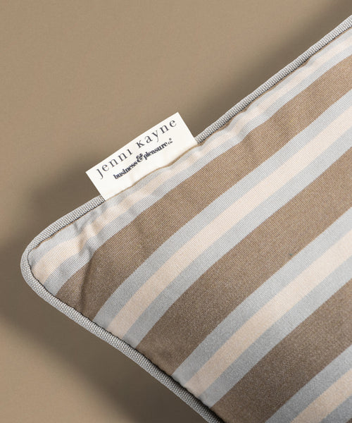 Striped pillow on a beige background