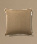 Brown pillow on a beige background