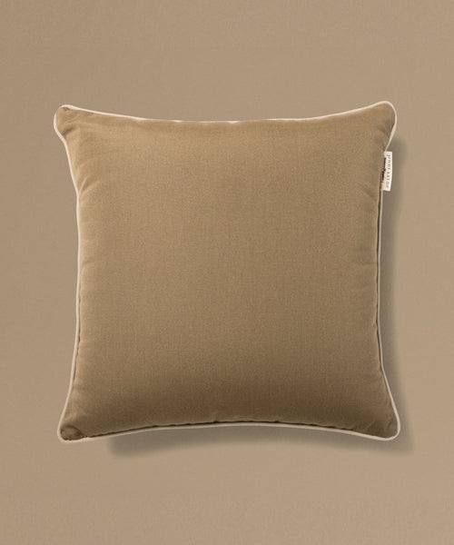 Brown pillow on a beige background