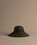 Olive Soleil hat on a beige background