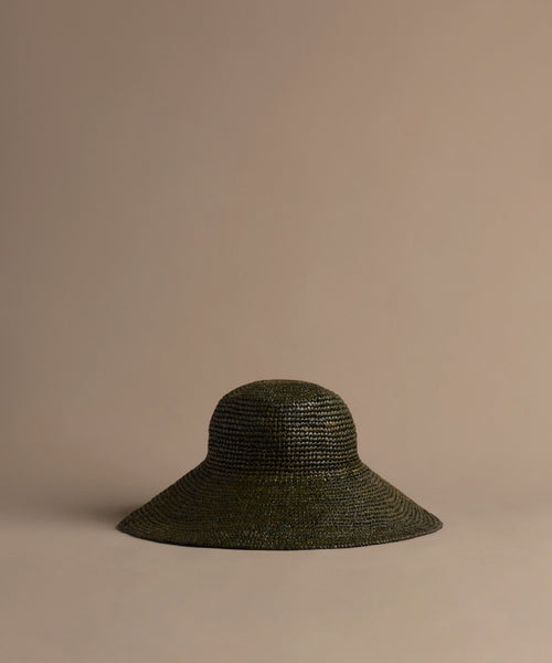 Olive Soleil hat on a beige background