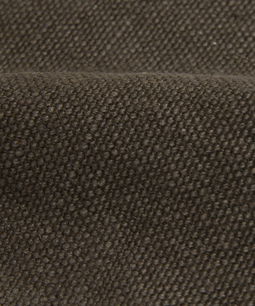 Close-up of dark brown Jet Linen fabric with a visible weave pattern and gentle folds, highlighting the depth and softness of the Cove Bed Slipcover’s Belgian linen upholstery.