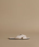 White sandal on a beige background