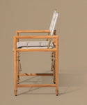 Wooden chair with a cushion on a beige background