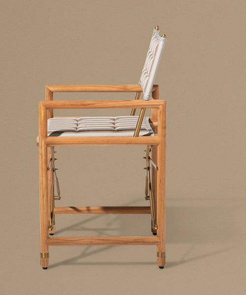 Wooden chair with a cushion on a beige background