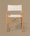Wooden chair with white cushion on a beige background
