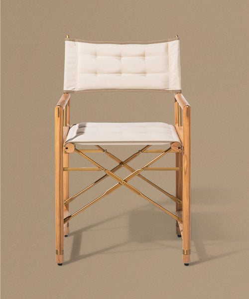 Wooden chair with white cushion on a beige background