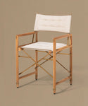 Wooden chair with white cushion on a beige background