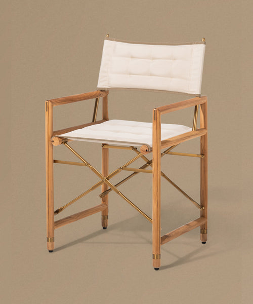 Wooden chair with white cushion on a beige background
