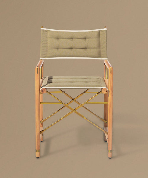 Foldable chair with wooden frame and beige cushion on a brown background