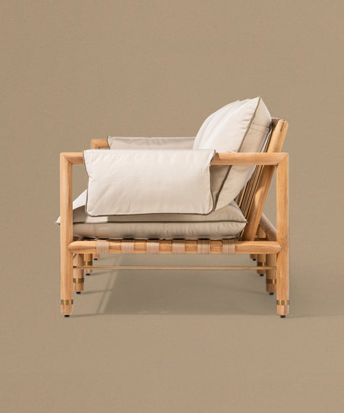 Beige sofa with wooden frame on a beige background