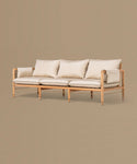 Beige sofa with light cushions on a beige background