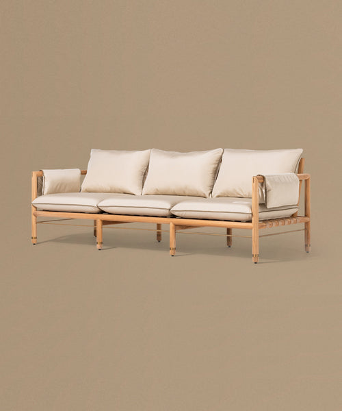 Beige sofa with light cushions on a beige background