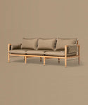 Beige sofa with brown cushions on a matching beige background