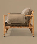 Brown sofa with wooden frame on a beige background