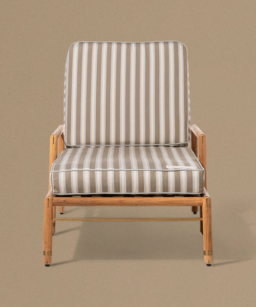 Chair with striped cushion on a beige background