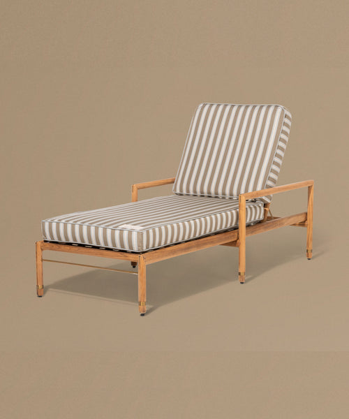 Wooden lounge chair with striped cushion on a beige background