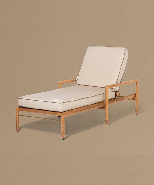 Beige lounge chair with white cushions on a beige background
