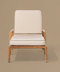 Beige lounge chair with white cushions on a beige background