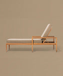 Wooden lounge chair with beige cushion on a beige background