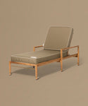Beige lounge chair with cushion on a brown background