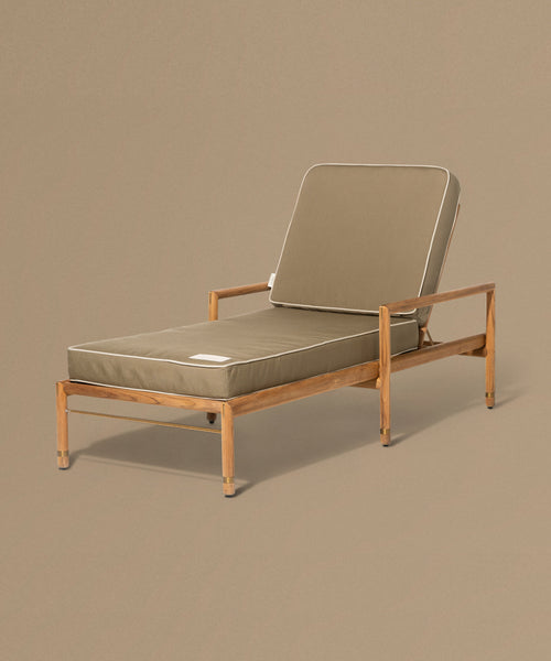 Beige lounge chair with cushion on a brown background