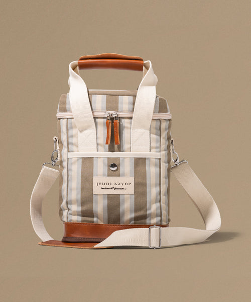 Stripped bag with leather accents on a beige background