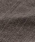 Close-up of the Fabric Swatch Ash Linen, highlighting its gray, textured weave and visible fibers with a slightly uneven surface.