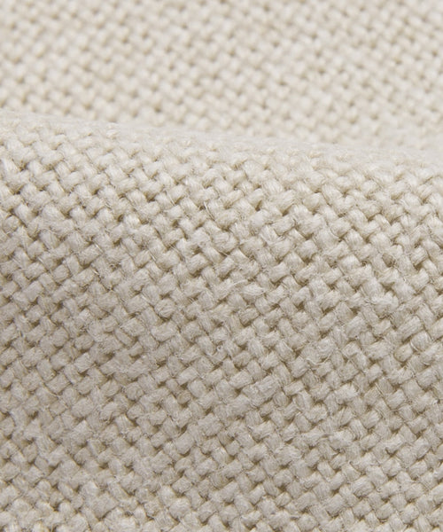 Close-up of Fabric Swatch Sandstone Linen, highlighting its coarse woven texture and interlaced natural fibers in a diagonal pattern. The thick, durable material is ideal for upholstery or craft projects.