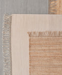 A close-up of the Arrowhead Jute Rug highlights its intricate handwoven texture and expert craftsmanship.