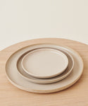 A stack of Pacific Platters rests on the table, each stoneware serving platter perfect for any gathering.