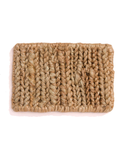 A rectangular Rug Swatch made of thick, natural-colored fibers in a textured, striped pattern. Its rustic look is similar to a Natural Wilder Jute Rug, offering both sturdiness and style.