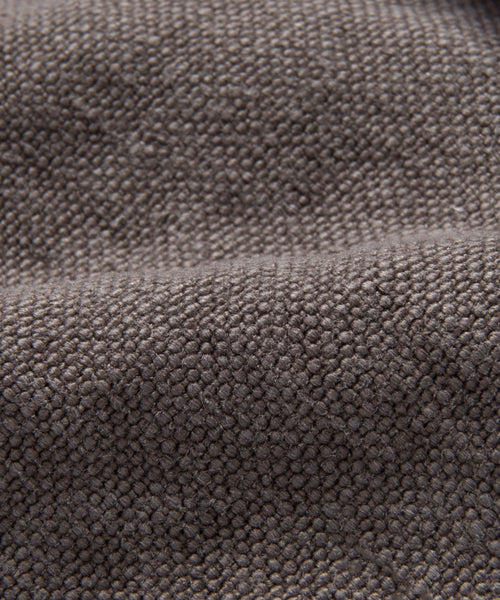 A close-up of the Fabric Swatch Charcoal Linen showcases its refined Belgian flax linen texture, as featured in Jenni Kayne Furniture.
