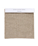 A square Fabric Swatch Flax Linen is attached to a white card labeled jenni kayne home and Flax Linen. This beige, coarse woven fabric is a popular choice for pieces such as the Miramar Sofa.