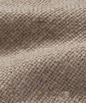 Close-up of the Fabric Swatch Flax Linen in natural beige, highlighting its grid-like pattern, visible fibers, and gentle folds—ideal for upholstery projects such as sofas.