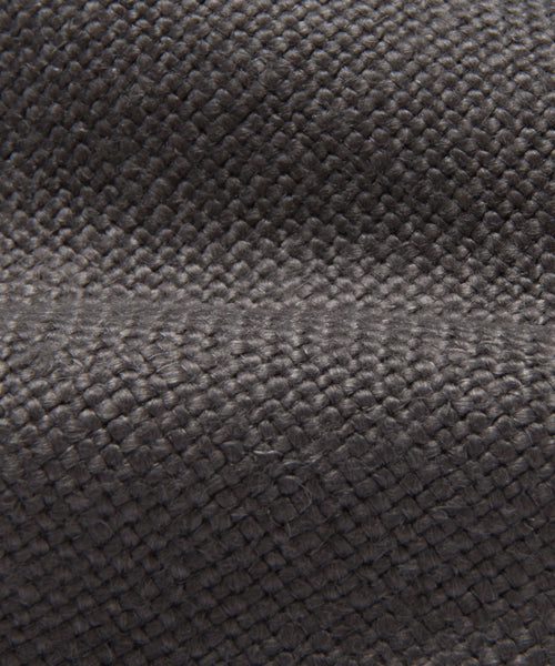 Close-up view of the Fabric Swatch Smoke Linen, highlighting its textured interlacing threads and a horizontal crease—ideal for visualizing this fabric on your next upholstery project.